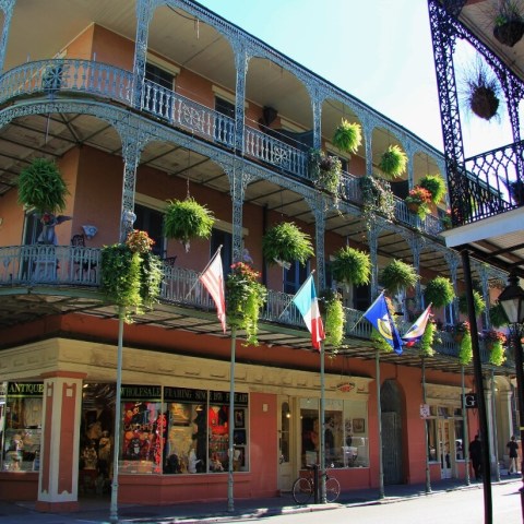 a group of people walking in front of a building