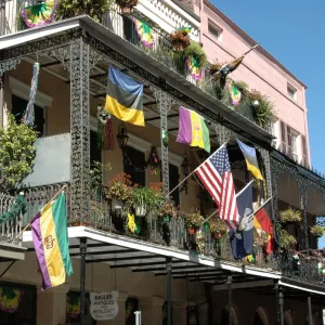 a group of people walking in front of a building
