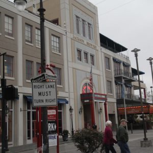 a group of people walking on a city street