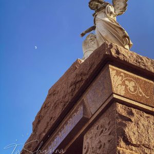 a large tall tower with a clock on the side of a building
